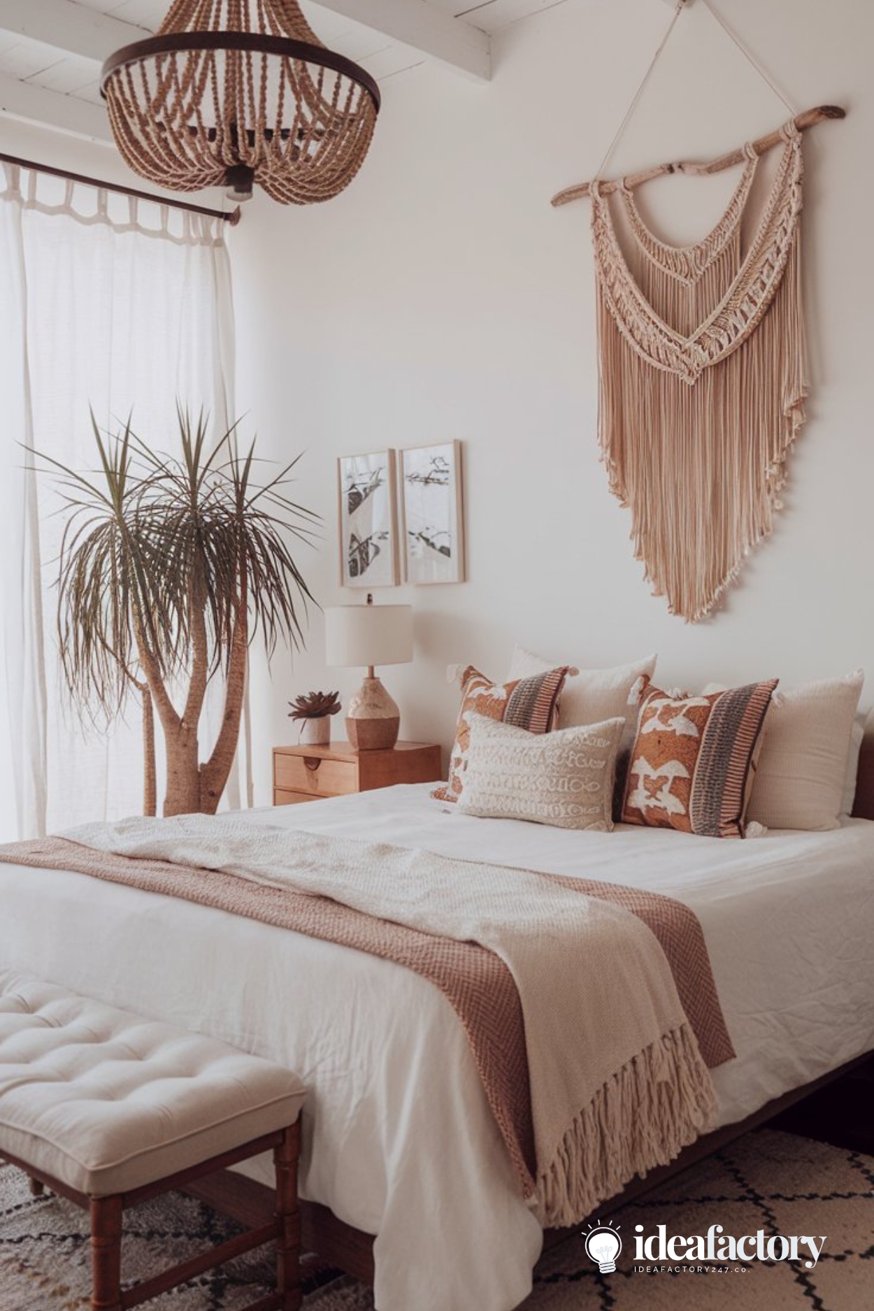 Modern boho bedroom decor with neutral colors and a pop of burnt sienna accents and accessories