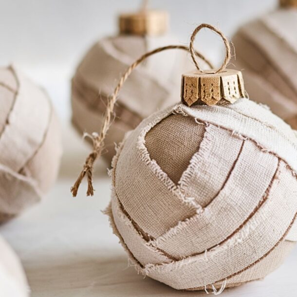 A collection of homemade Christmas ornaments using torn rags creating a hippie boho neutral decor.