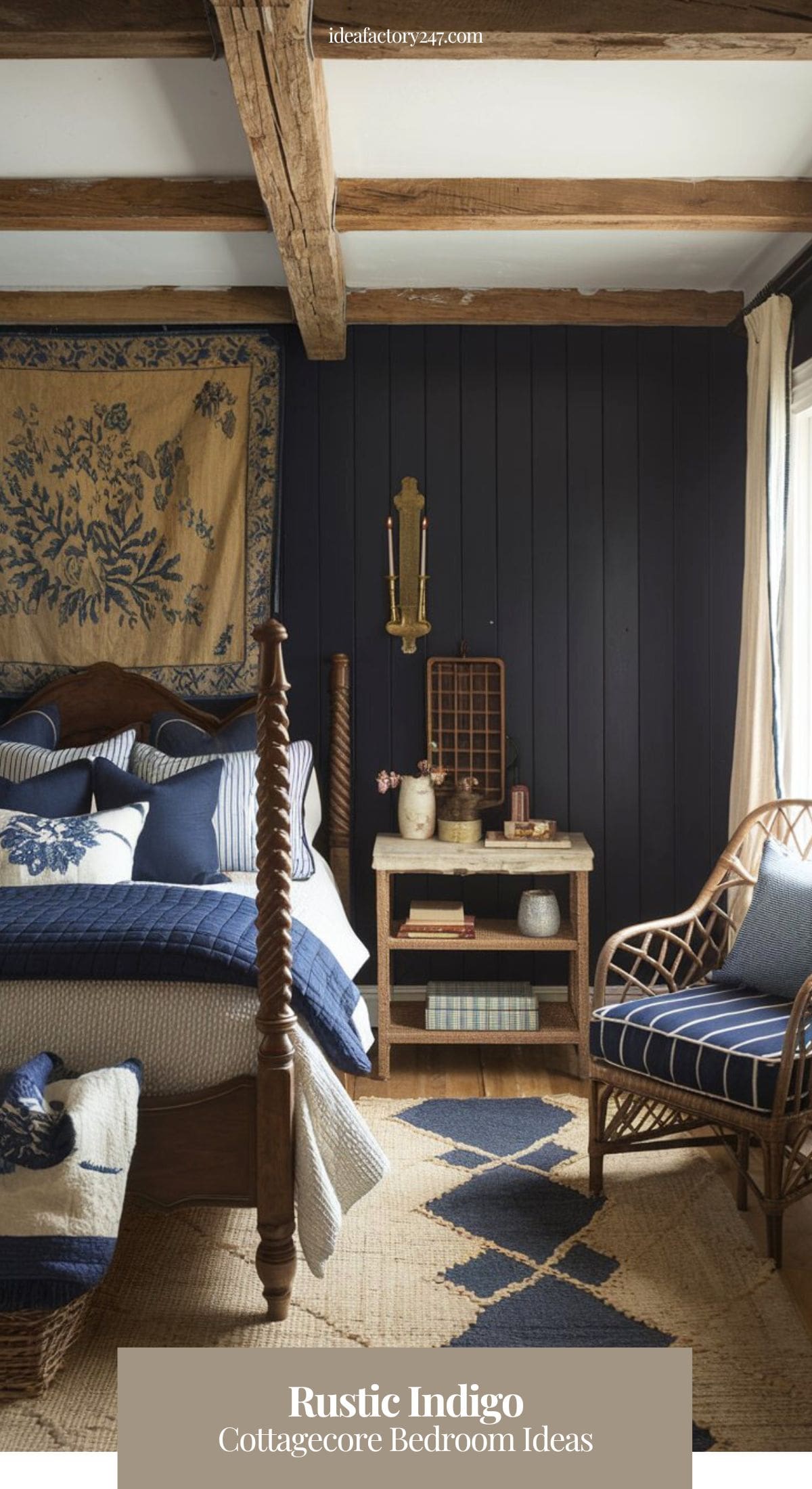 A rustic and cozy cottagecore retreat featuring deep indigo-painted walls with exposed wooden beams, adding warmth and texture. A hand-carved wooden bedframe is dressed in layered blue and cream bedding, with a quilted navy throw at the foot.