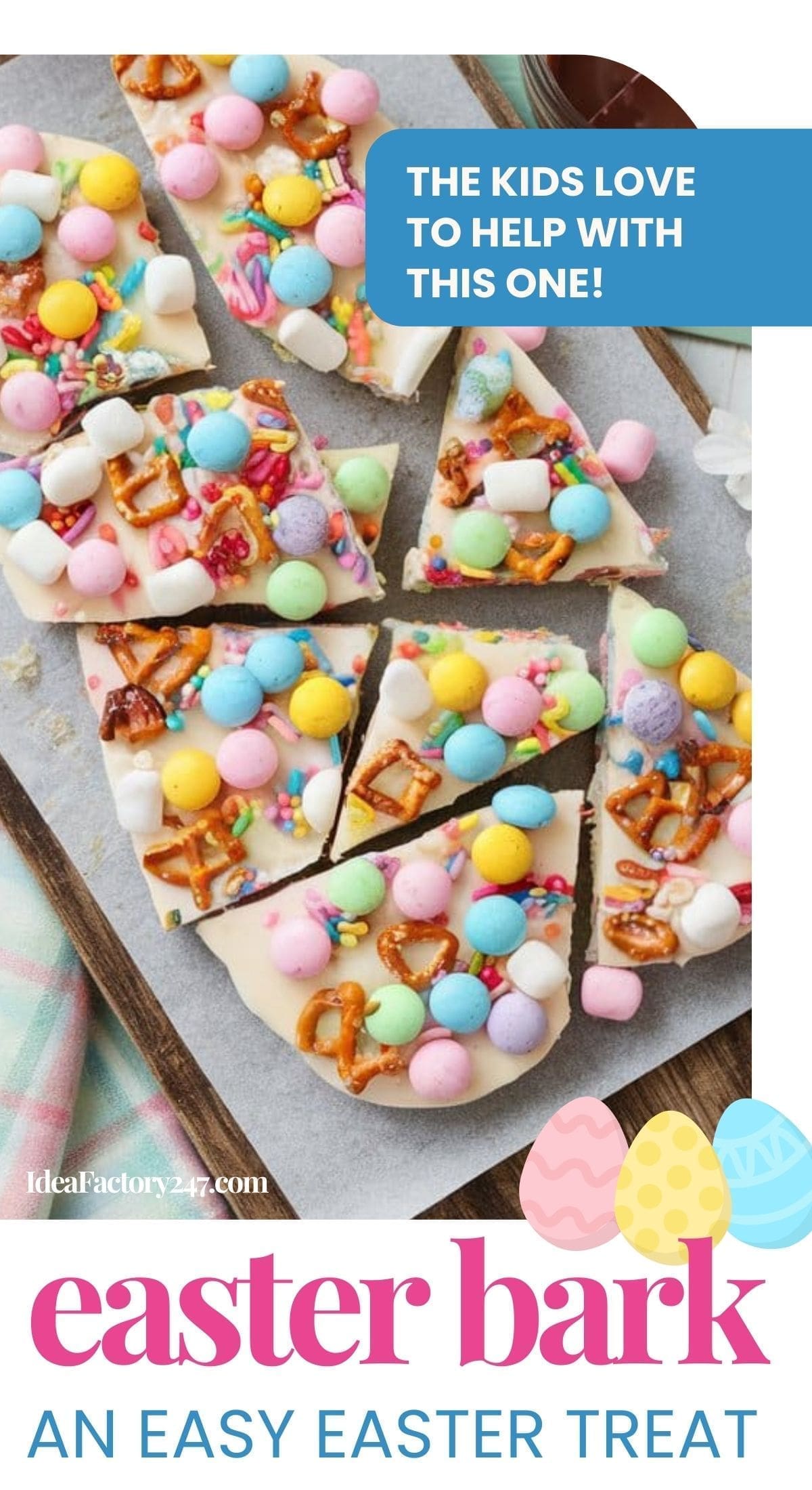 Colorful Easter bark topped with pastel candies, mini marshmallows, and pretzel pieces is cut into squares on a wooden board. Text reads: The kids love to help with this one! Easter bark is a fun, easy Easter treat.