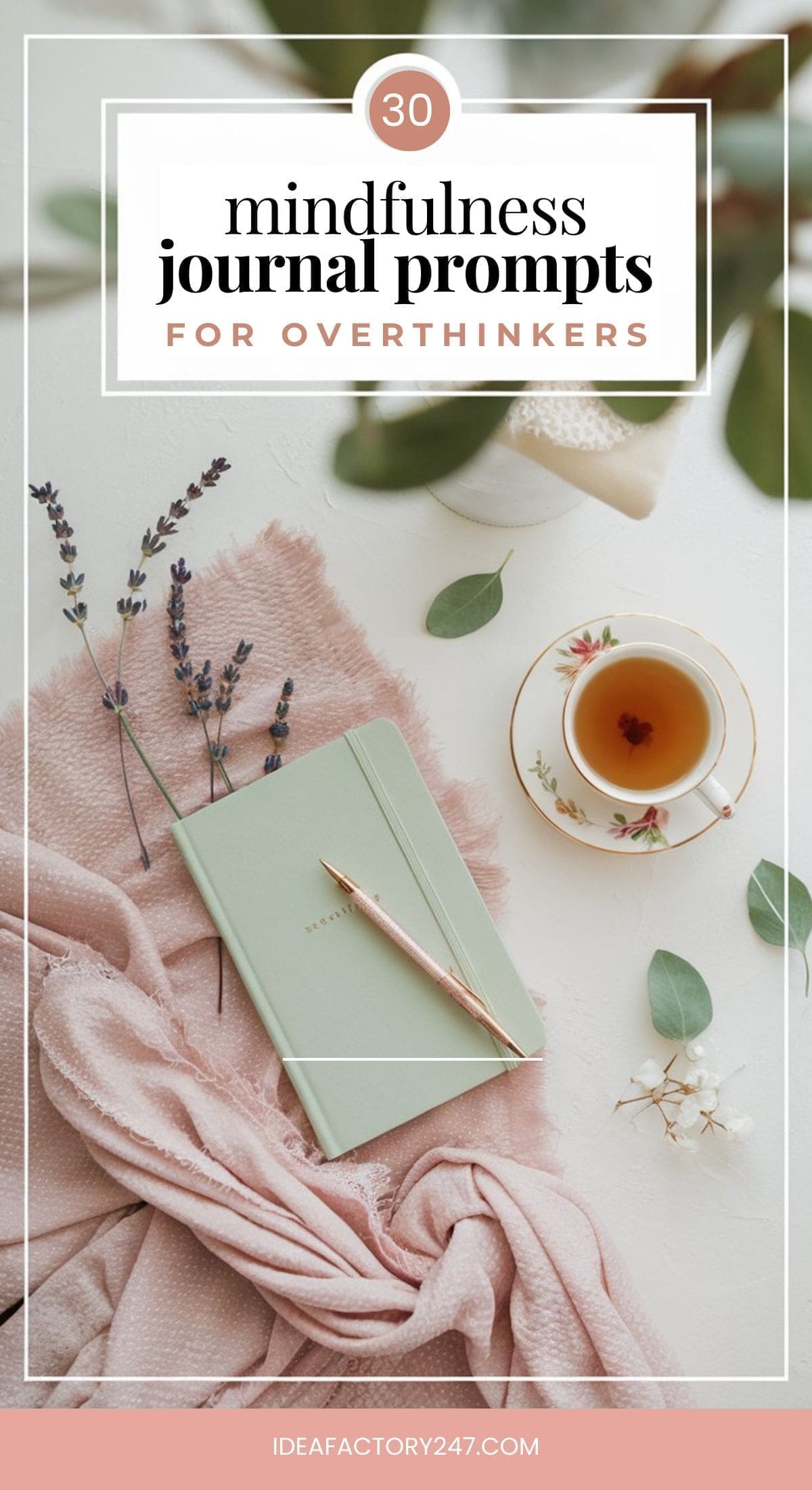 A flat lay image showcases a green journal with a pen on a pink blanket, surrounded by lavender, eucalyptus leaves, and a cup of tea. The text highlights 30 mindfulness journal prompts for overthinkers, inviting serenity and reflection.
