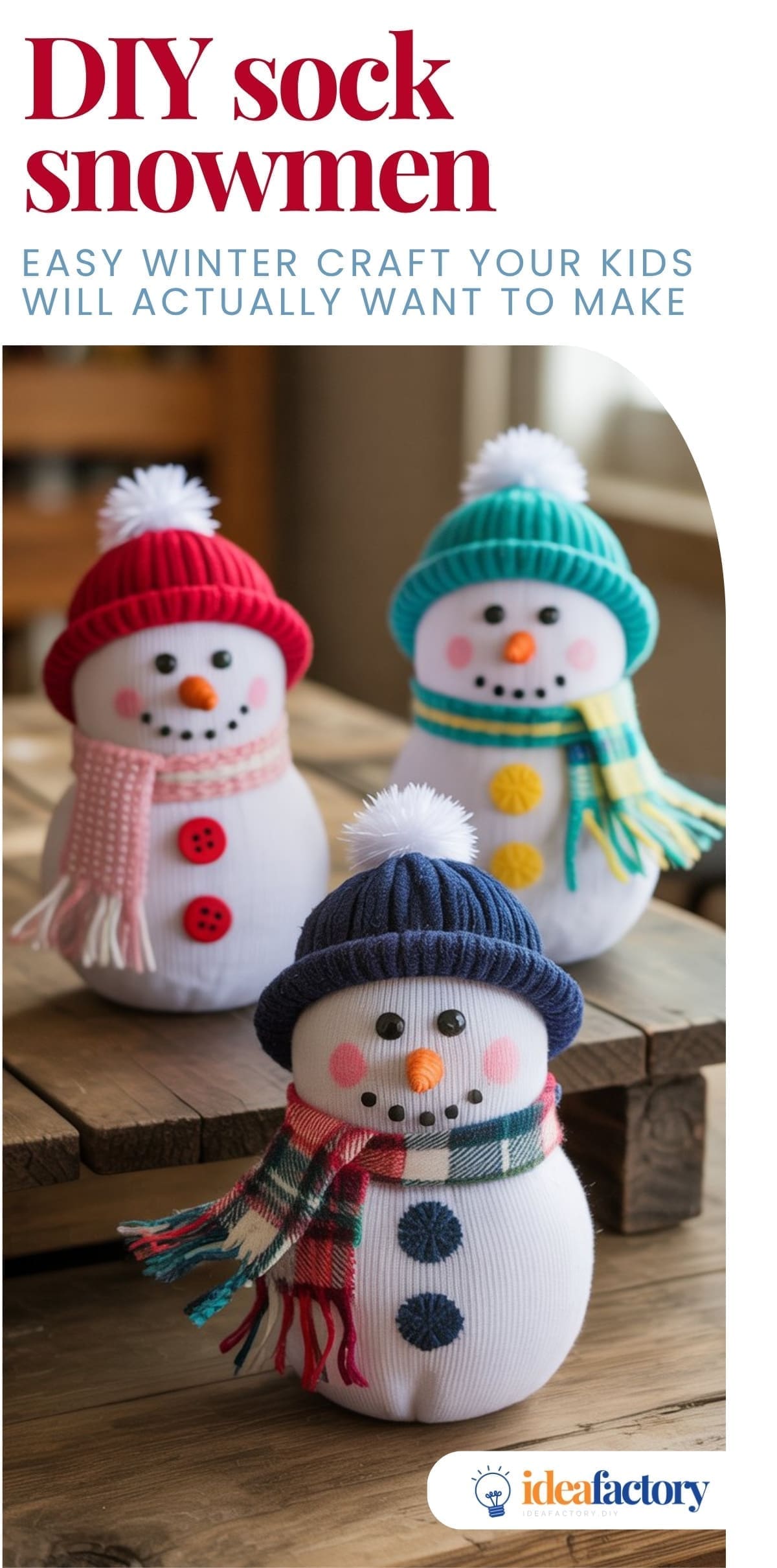 Three handmade sock snowmen with colorful hats and scarves, button eyes, carrot noses, and smiling faces are displayed on a wooden table as a fun winter craft project for kids.