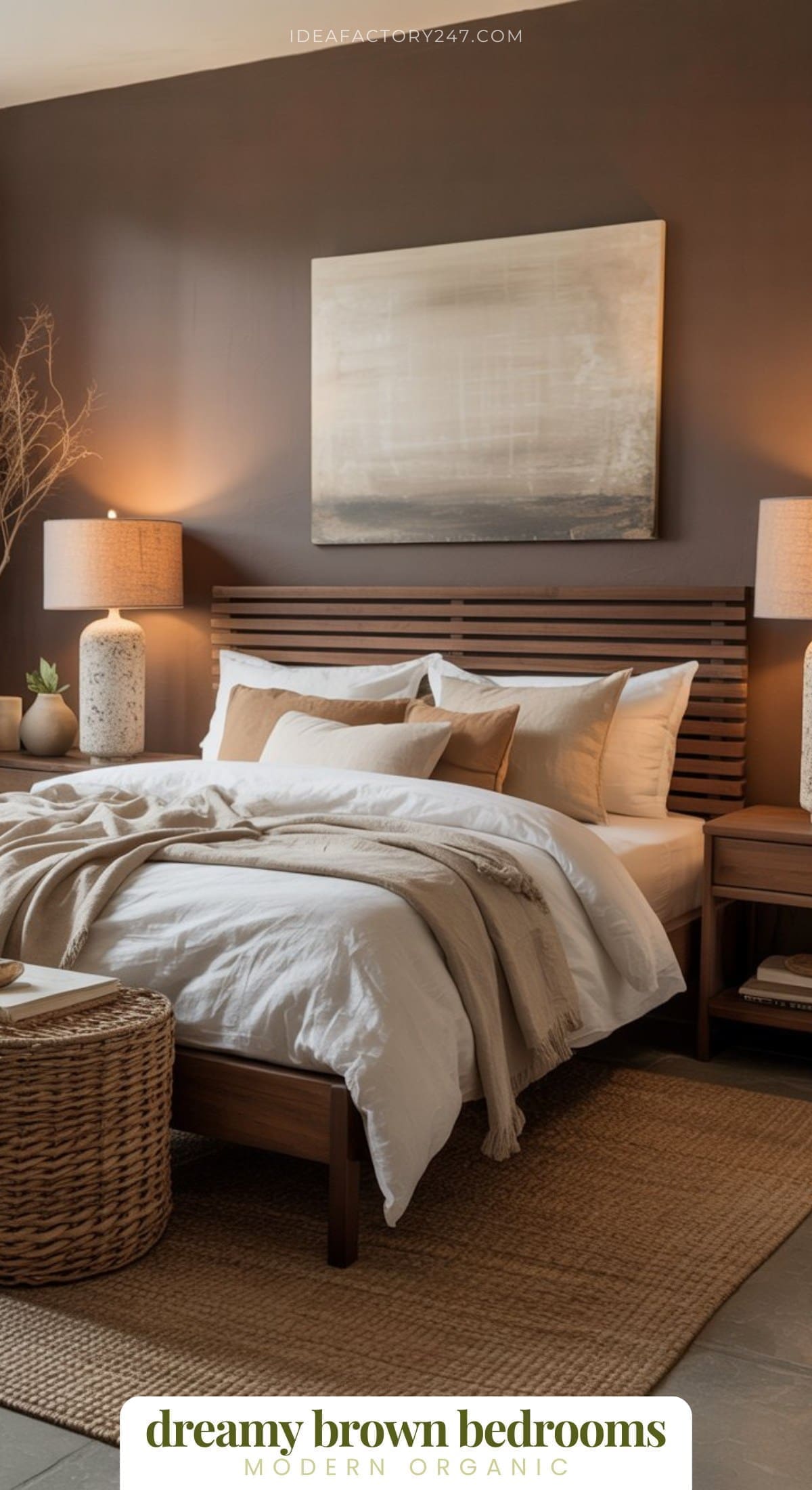 A cozy bedroom with a wooden bed, white bedding, brown pillows, beige throw, two bedside tables with lamps, wicker basket, textured rug, and a neutral abstract painting on a brown wall. Text reads: dreamy brown bedrooms.