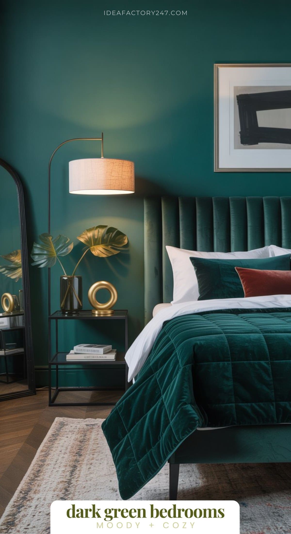 Dreaming of a Dark Green Bedroom? This is part of our 20+ moody green bedrooms collection. A stylish bedroom with dark green walls and bedding, a velvet headboard, modern floor lamp, gold decor, framed art, a bedside table with books, and a large mirror, creating a moody and cozy atmosphere.