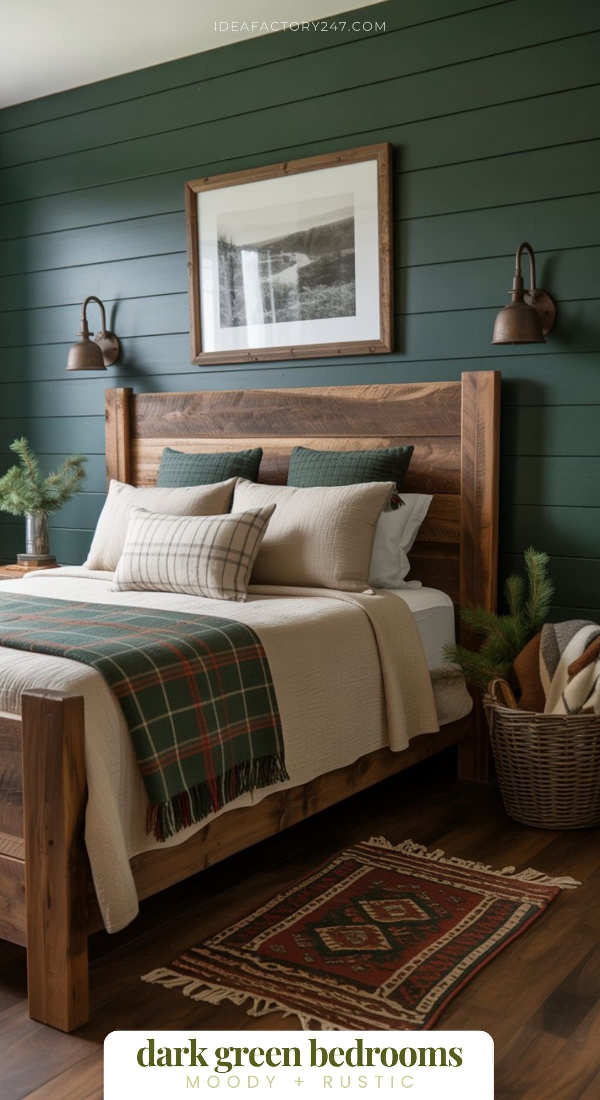 Dreaming of a Dark Green Bedroom? This is part of our 20+ moody green bedrooms collection. This green bedroom is a  cozy rustic space with dark green shiplap walls, a wooden bed frame, plaid bedding, wall sconces, a nature photo above the bed, and a woven basket with pine branches and blankets on a wooden floor.