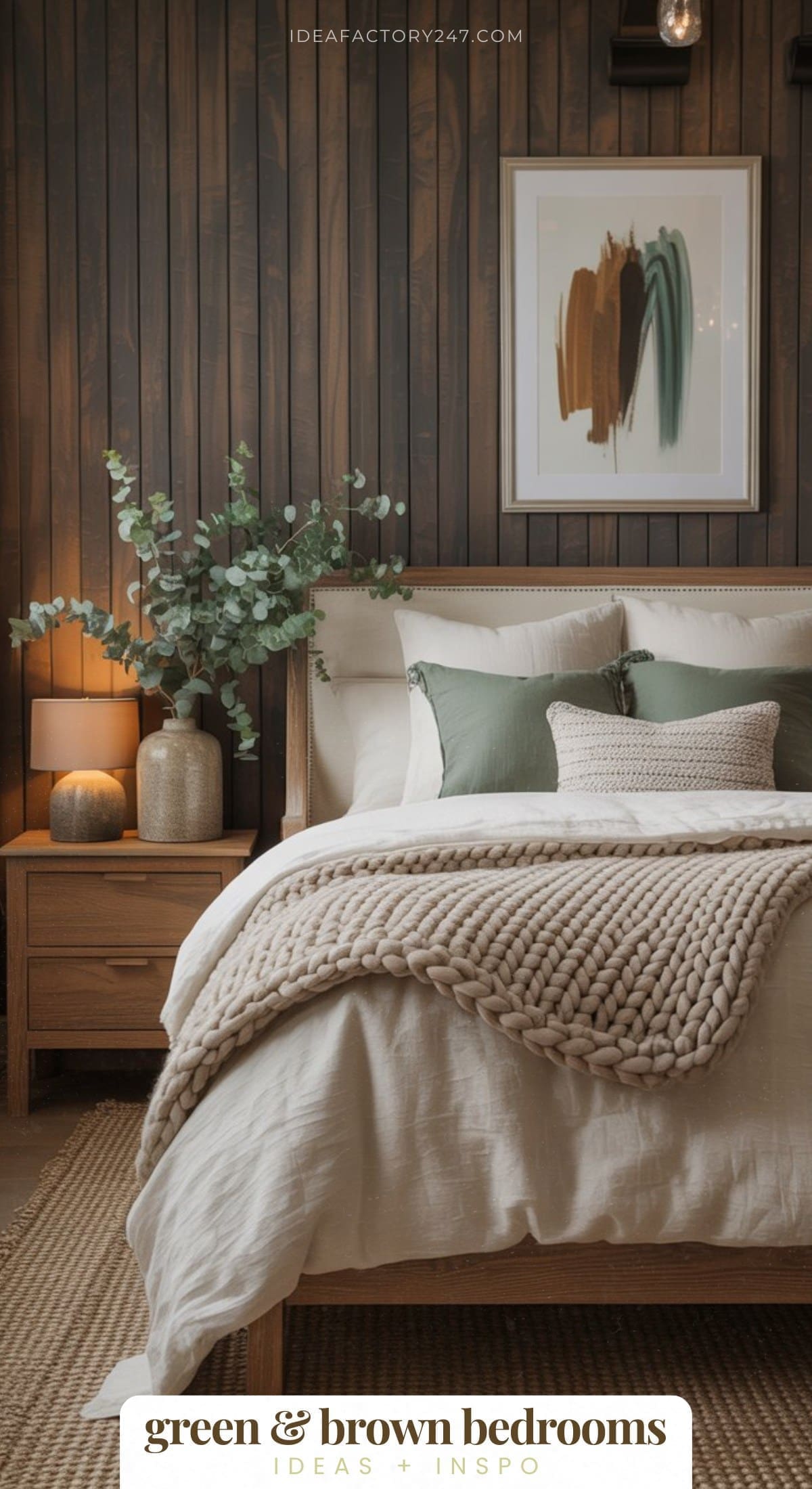 A cozy bedroom with a beige bedspread, chunky knit blanket, green and cream pillows, a wooden nightstand with a lamp, a vase of greenery, and abstract wall art on a dark wood-paneled wall. Text reads green & brown bedrooms.