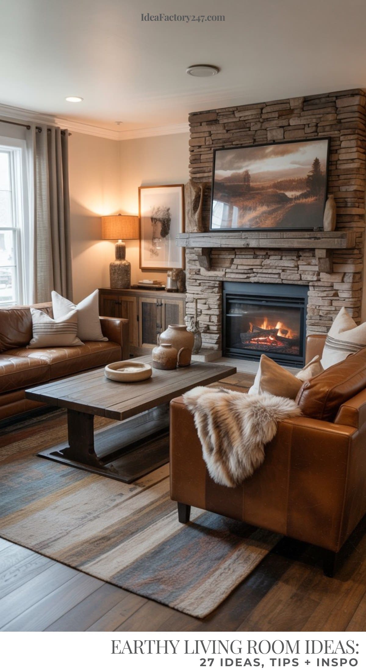 An cozy room featuring brown leather sofas, a wooden coffee table, neutral throw pillows, a fur throw, stone fireplace, landscape artwork, and soft natural light from a nearby window creates a warm and inviting space.