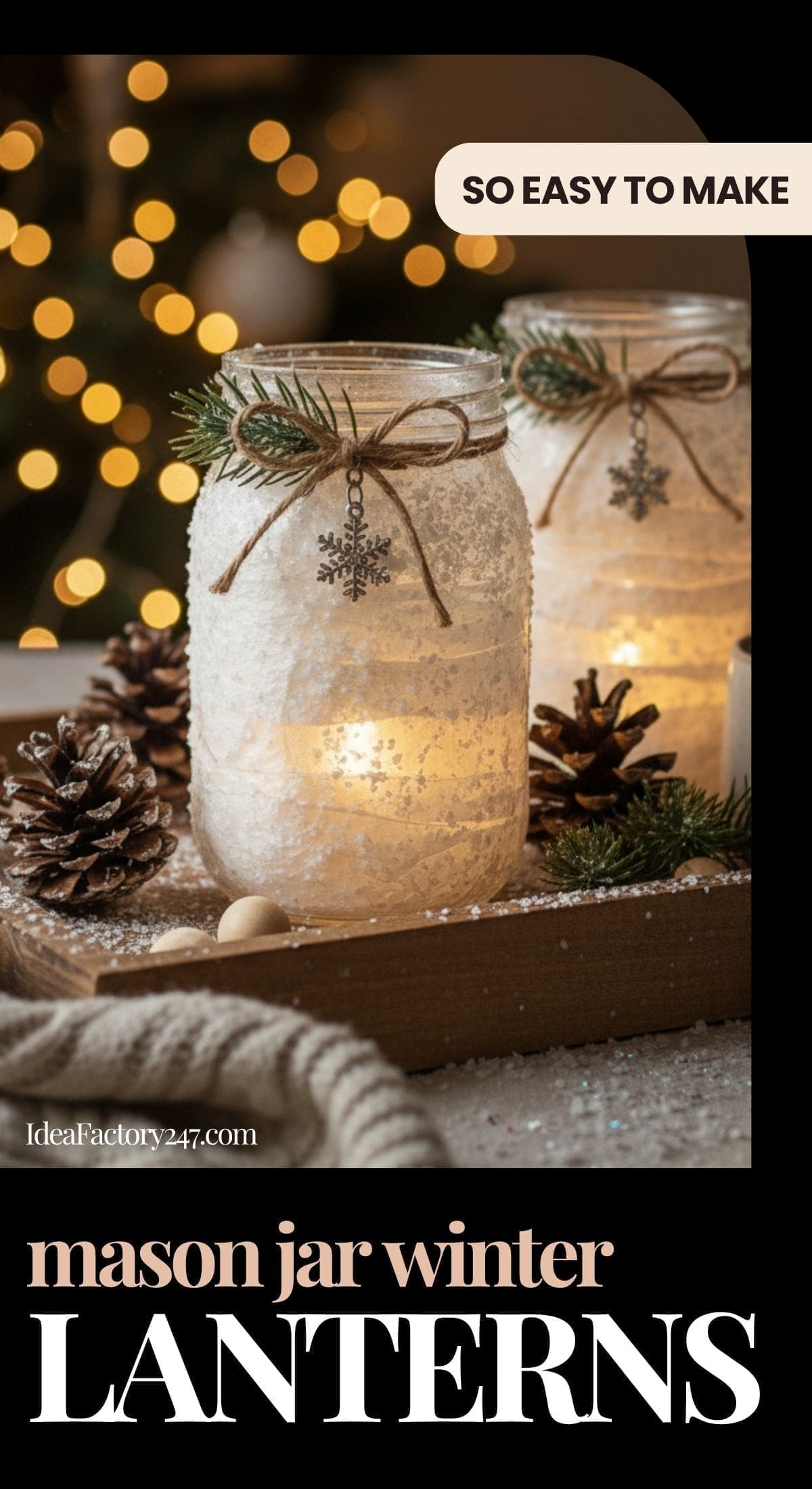Two mason jar lanterns decorated with twine, pine sprigs, and snowflake charms, glowing with candlelight. Surrounded by pine cones and fairy lights, creating a cozy winter scene. Text: So easy to make. Mason jar winter lanterns.