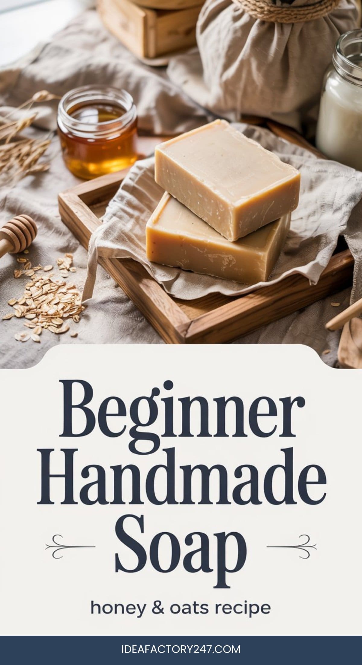 Two rectangular bars of honey and oat soap rest on a wooden tray surrounded by oats, a jar of honey, and a honey dipper. Text below reads, Beginner Handmade Soap, honey & oats recipe.