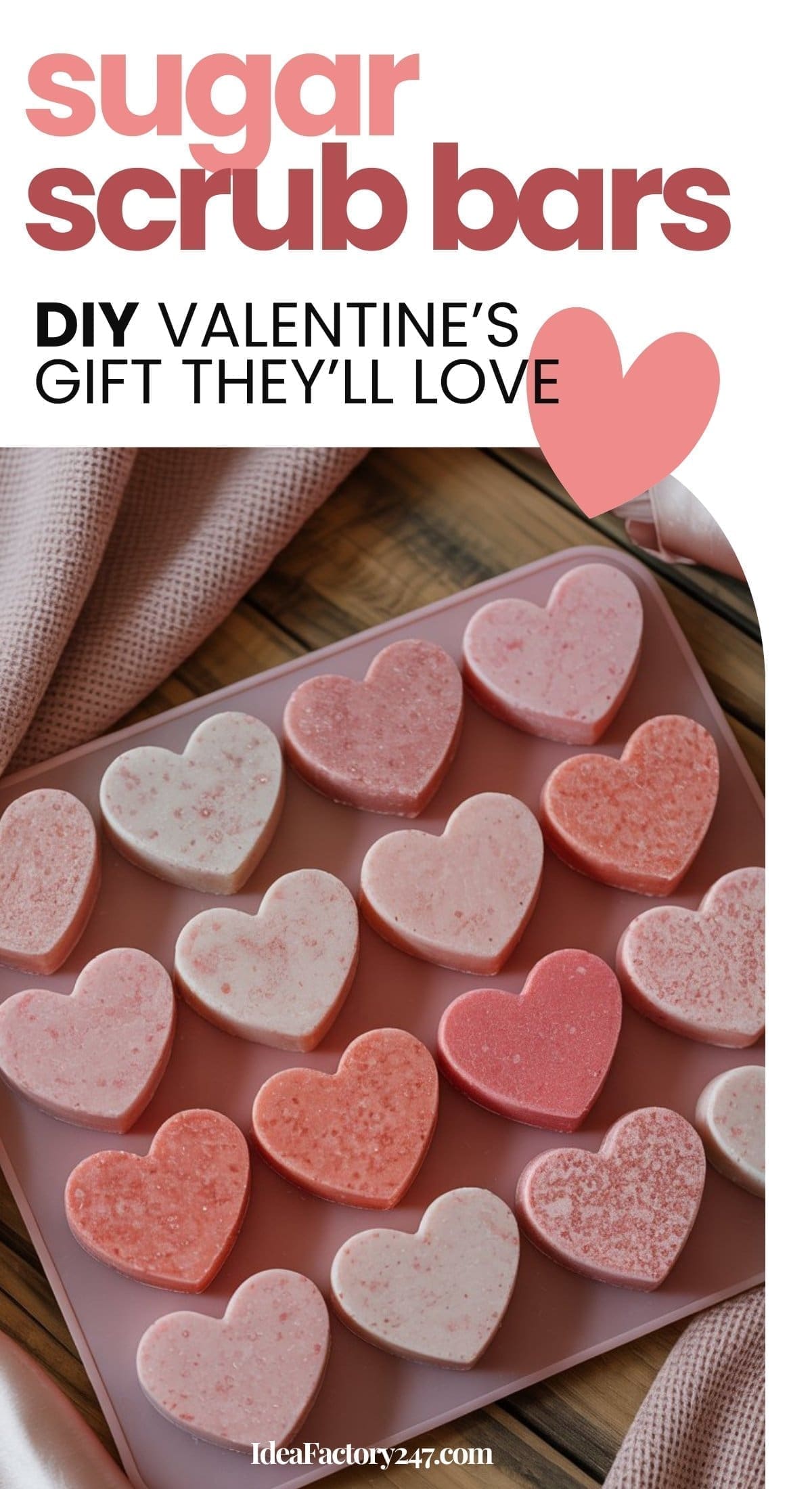 A tray of Heart Sugar Scrub Bars in pink and red sits on a wooden surface with a pink towel, accompanied by text promoting DIY Valentine’s gift ideas.