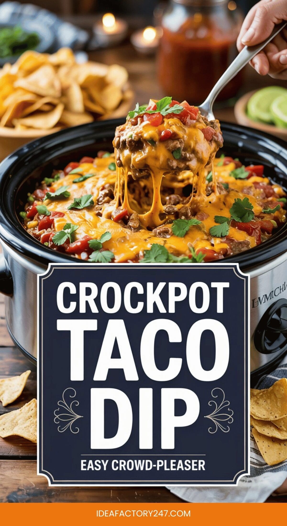 A crockpot filled with cheesy crockpot taco dip topped with tomatoes and cilantro, with a spoon lifting a portion. Chips, limes, and salsa are in the background. Text reads: Crockpot Taco Dip - Easy Crowd-Pleaser.