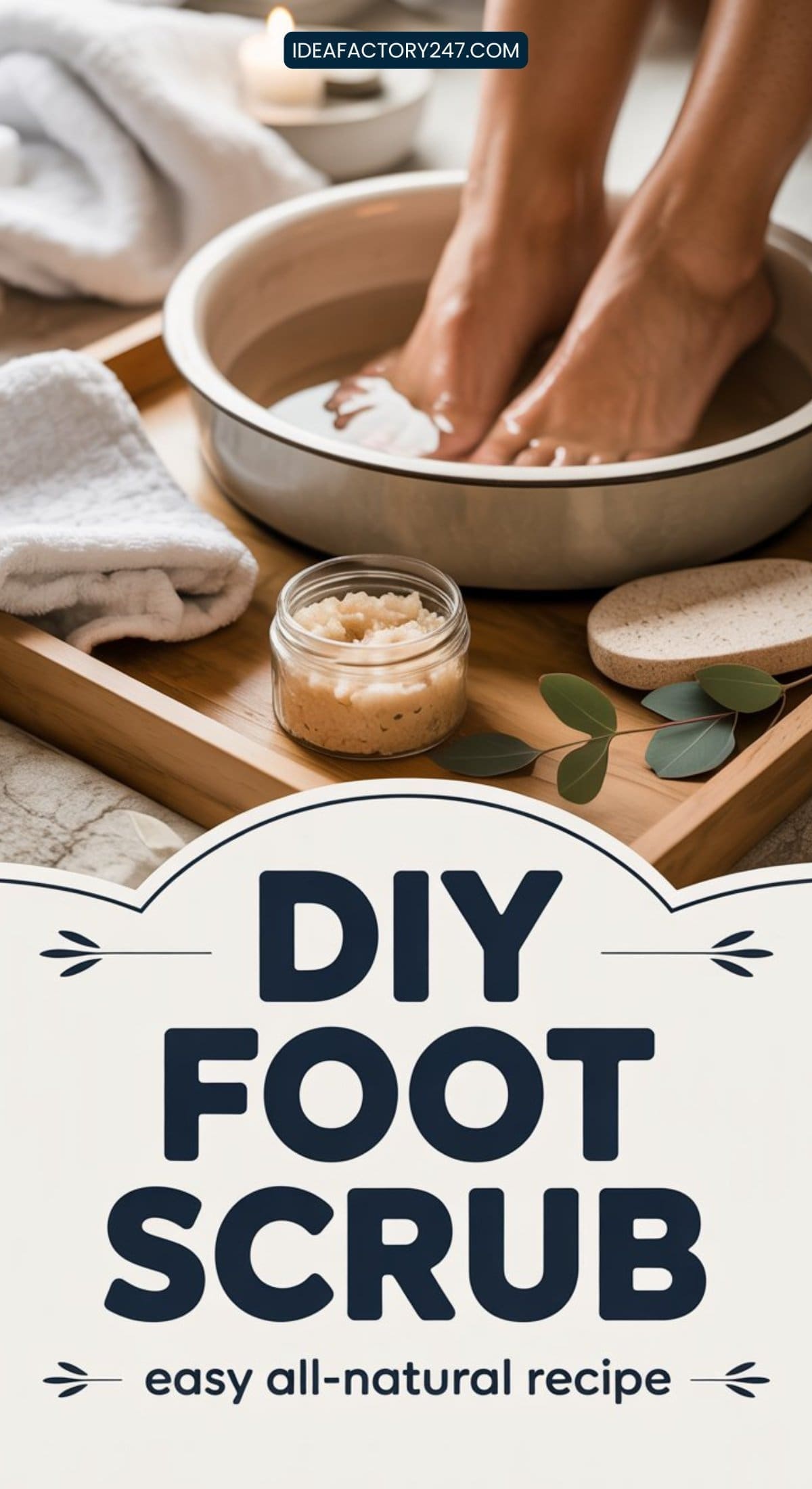 A person enjoys a relaxing DIY foot scrub, soaking their feet in a metal basin on a wooden tray alongside a jar of scrub, towels, and pumice stones. Text reads: DIY Foot Scrub - easy all-natural recipe.