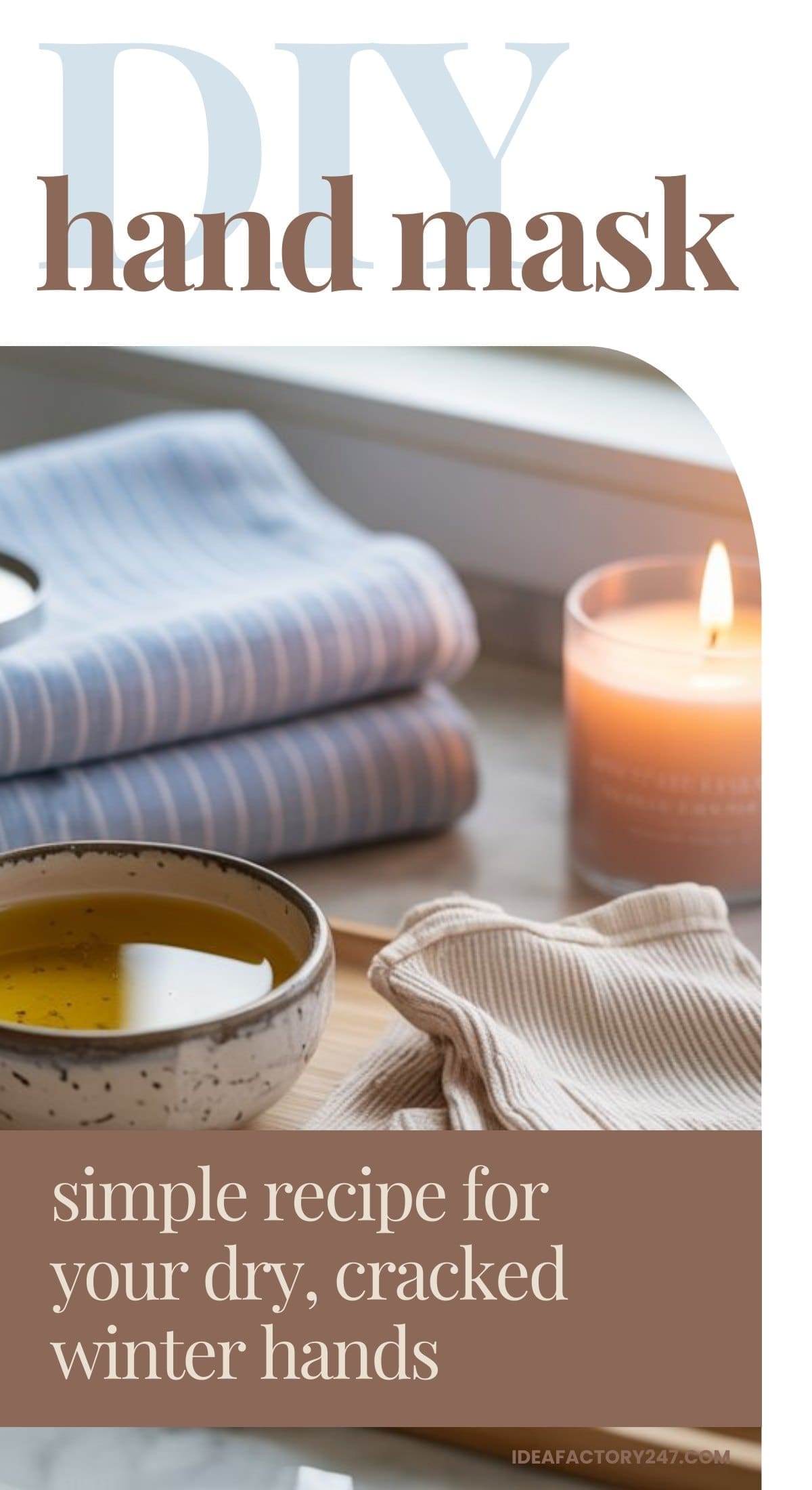 A cozy setup with a lit candle, folded striped towels, a bowl of oil, and gloves. Text reads: “DIY hand masks: simple recipe for your dry, cracked winter hands.”.
