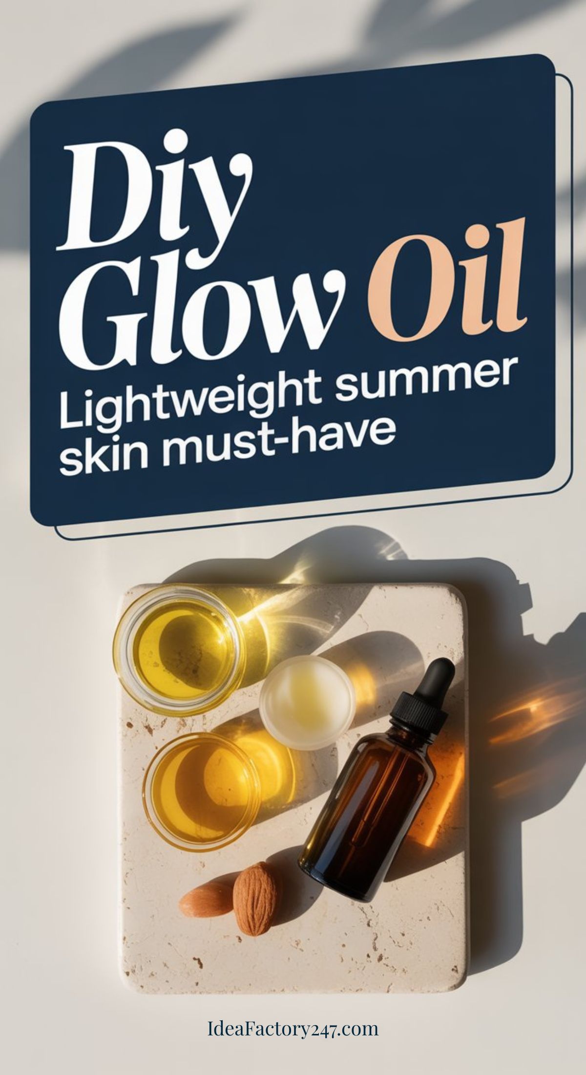 A flat lay of a dropper bottle, small bowls of oil, and an almond on a stone slab, with text reading DIY Glow Oil: Lightweight summer skin must-have. Sunlight casts shadows across the scene.