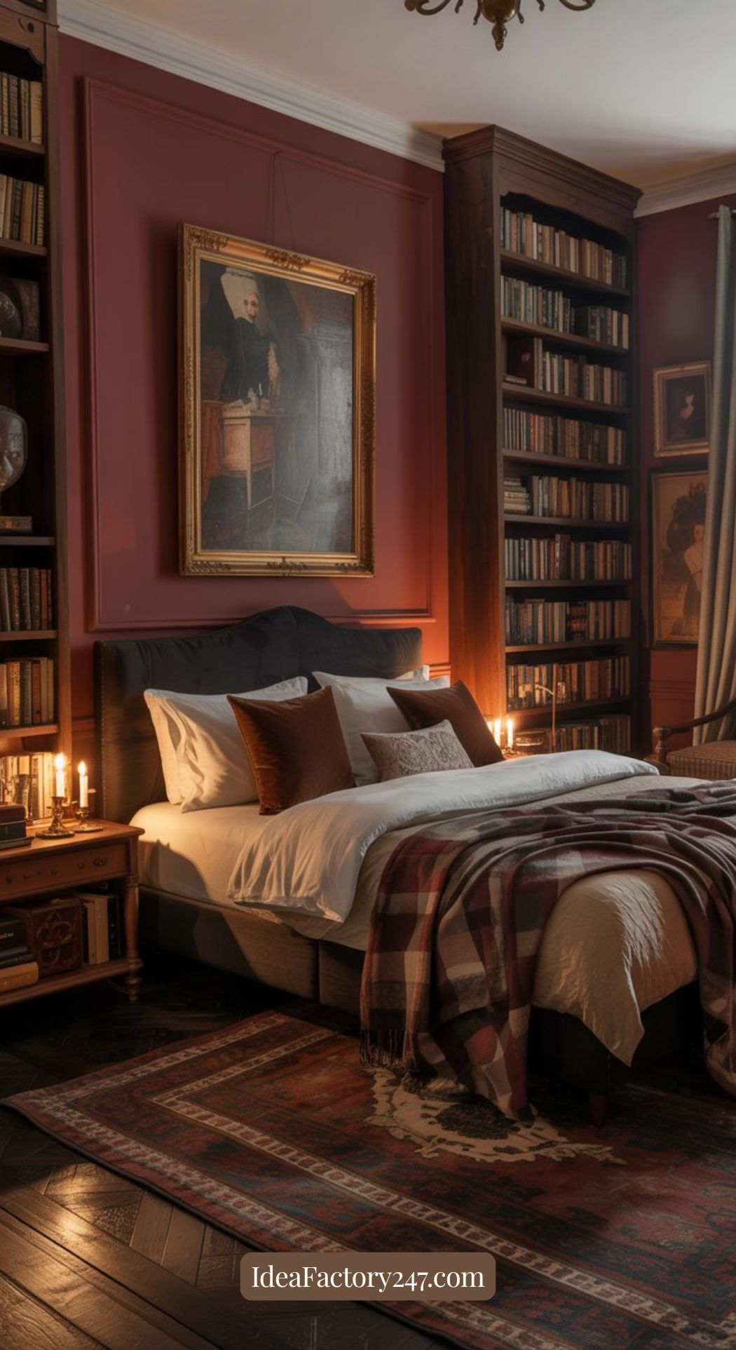 A cozy bedroom with a large bed, plaid blanket, and multiple pillows, surrounded by bookshelves and lit candles. A portrait hangs above the bed, and the room has warm, dark wood and red tones.