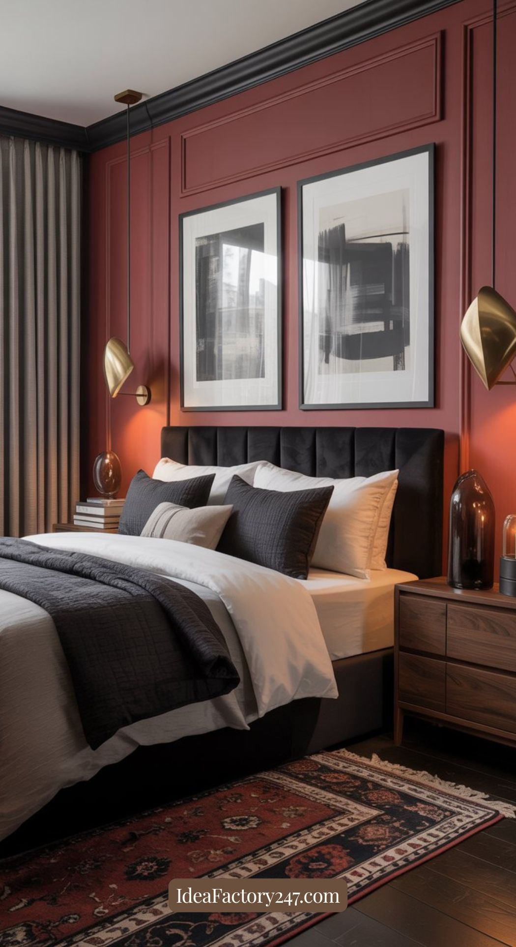 A modern bedroom with a black tufted headboard, white and dark gray bedding, a red accent wall, abstract art, gold wall lamps, wood nightstands, gray curtains, and a patterned rug. Text: IdeaFactory247.com.