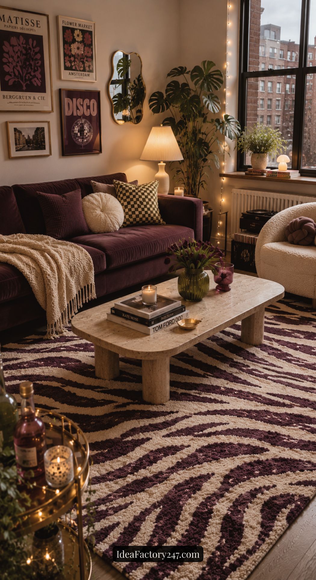 A cozy living room with a purple sofa, zebra-patterned rug, coffee table with books and candles, wall art, plants, and string lights, featuring warm and inviting décor with large windows overlooking city buildings.