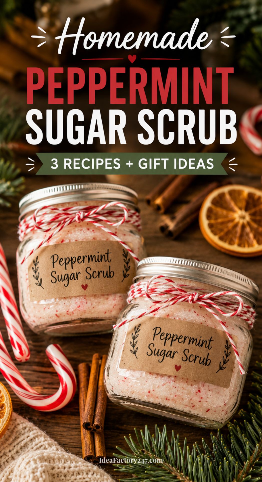 Two jars of homemade peppermint sugar scrub with red and white string, labeled tags, and surrounded by candy canes, cinnamon sticks, pine branches, and dried orange slices on a rustic table. Text reads Homemade Peppermint Sugar Scrub.