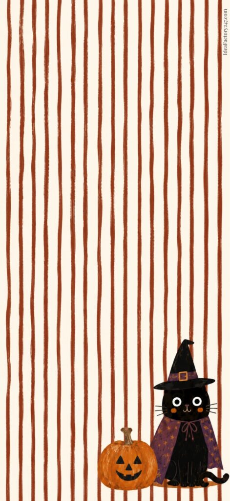 A cute black cat in a witch hat and cape sits next to a carved pumpkin on a striped brown and beige background.