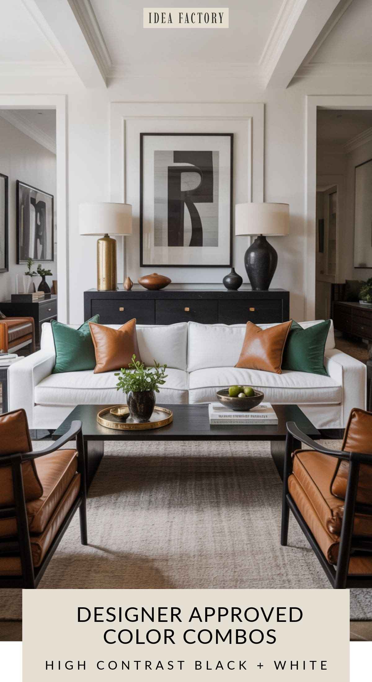 Living room featuring a white sofa with green and tan pillows, a black coffee table, two leather armchairs, and a black credenza topped with lamps and abstract wall art.